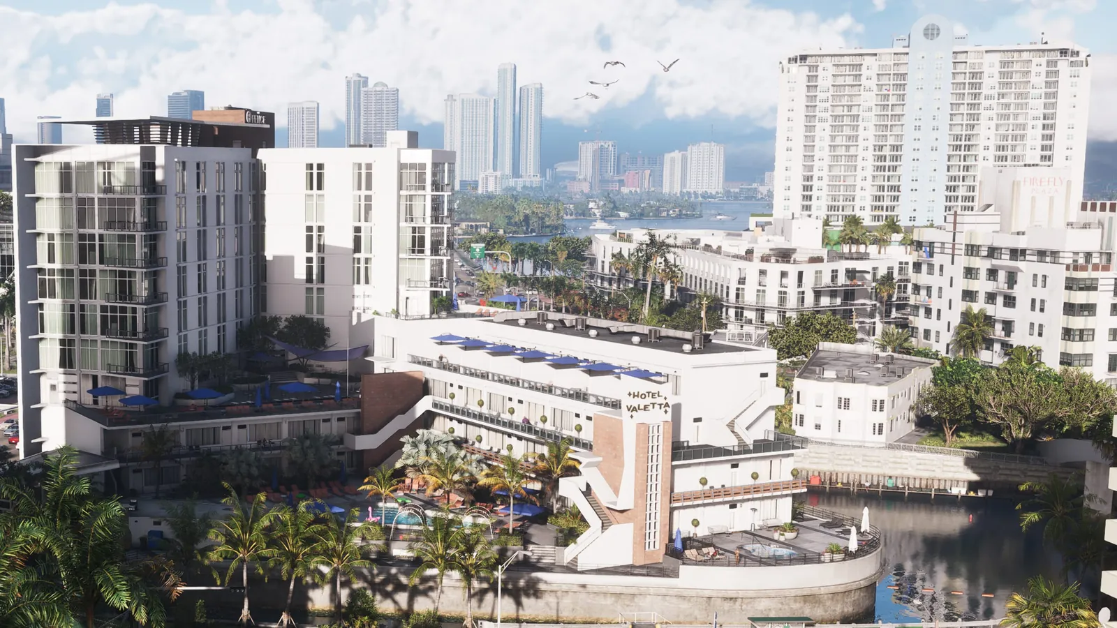 Firefly Plaza in GTA VI: The Firefly Plaza tower and its rooftop sign rise over Hotel Valetta and a Vice Beach canal.