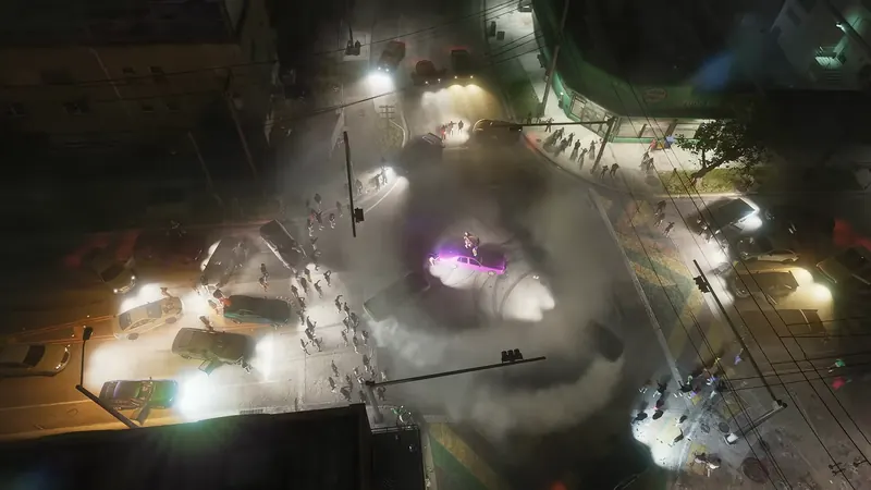 What's Cooking in GTA VI: Overhead night view of a street takeover as cars do doughnuts at a Crosstown intersection beside a corner store.