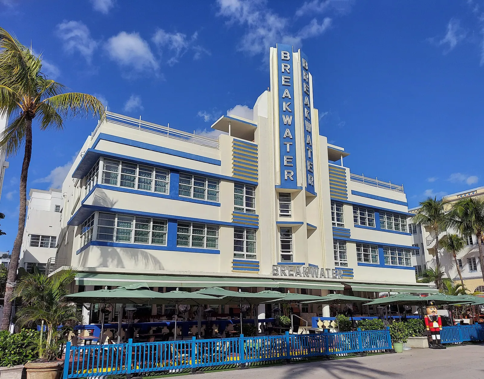 Hotel Breakwater, real-world photo: The Breakwater Hotel and its neon tower sign on Ocean Drive, 2021