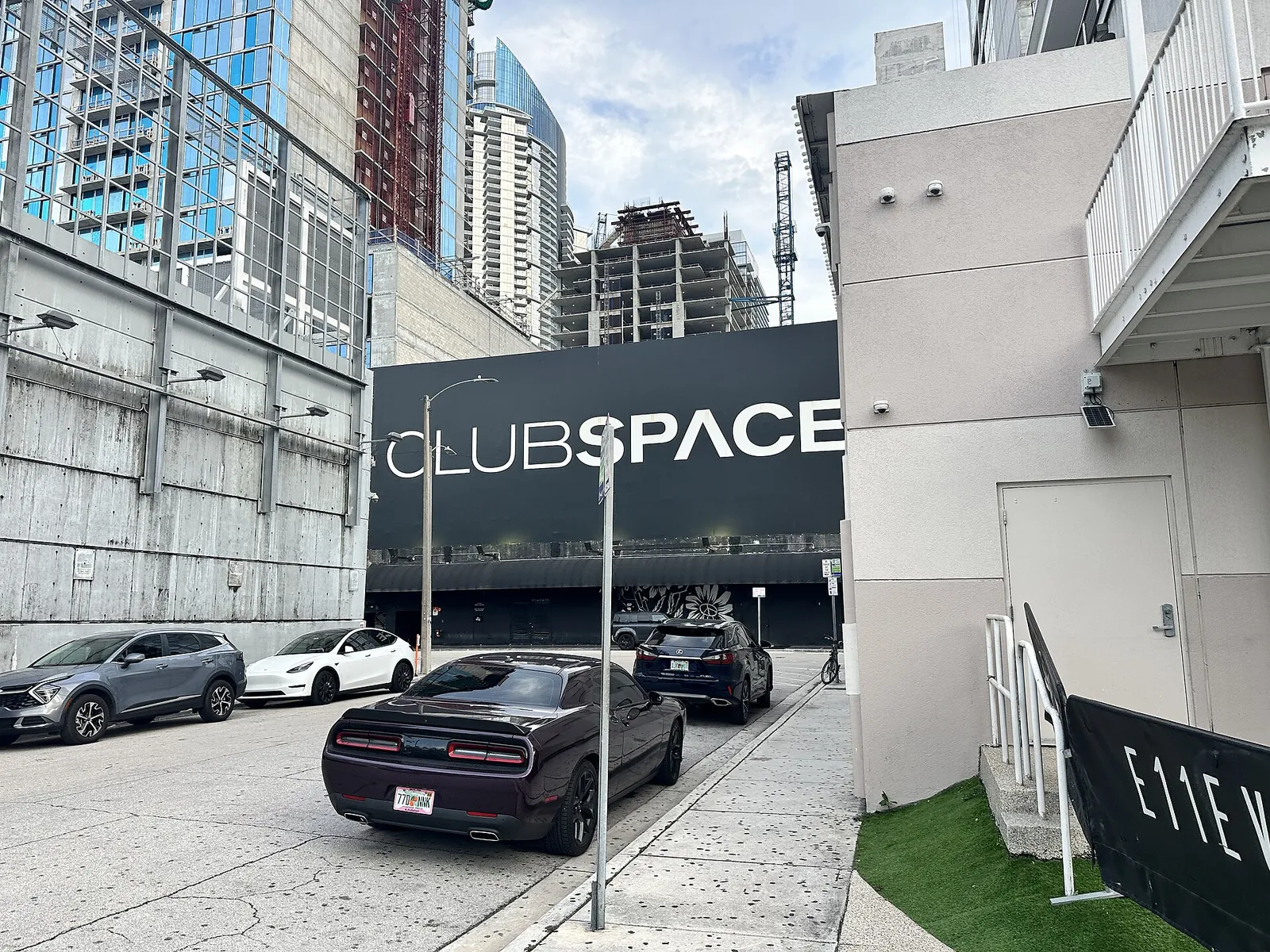 Club Space, real-world photo: Club Space on NE 11th Street, with an E11EVEN sign at lower right, 2025